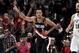 Portland Trail Blazers guard CJ McCollum, left, reacts after hitting a shot, next to San Antonio Spurs guard Marco Belinelli during the second half of an NBA basketball game in Portland, Ore., Thursday, Feb. 7, 2019. The Blazers won 127-118. (AP Photo/Steve Dykes)