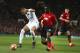 Paris Saint Germain's Kylian Mbappe, left, defends the ball as Manchester United's Eric Bailly goes to challenge during the Champions League round of 16 soccer match between Manchester United and Paris Saint Germain at Old Trafford stadium in Manchester, England, Tuesday, Feb. 12,2019.(AP Photo/Dave Thompson)