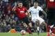 MANCHESTER, ENGLAND - FEBRUARY 12: Alexis Sanchez of Manchester United, Dani Alves of PSG during the UEFA Champions League Round of 16 First Leg match between Manchester United (Man U) and Paris Saint-Germain (PSG) at Old Trafford stadium on February 12, 2019 in Manchester, England. (Photo by Jean Catuffe/Getty Images)