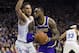 Los Angeles Lakers' LeBron James, right, makes his move against Philadelphia 76ers' Ben Simmons, left, of Australia, during the first half of an NBA basketball game, Sunday, Feb. 10, 2019, in Philadelphia. (AP Photo/Chris Szagola)
