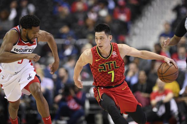Atlanta Hawks guard Jeremy Lin (7) dribbles the ball against Washington Wizards guard Chasson Randle (9) during the first half of an NBA basketball game, Monday, Feb. 4, 2019, in Washington. (AP Photo/Nick Wass)