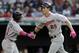 Minnesota Twins' Max Kepler (26) is congratulated by Jorge Polanco after hitting a solo home run off Cleveland Indians relief pitcher Dan Otero in the sixth inning of a baseball game, Saturday, May 13, 2017, in Cleveland. (AP Photo/Tony Dejak)