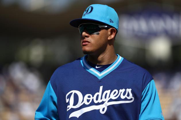 LOS ANGELES, CA - AUGUST 26: Manny Machado #8 of the Los Angeles Dodgers jogs back to the dugout for the middle of the seventh inning during the MLB game at Dodger Stadium on August 26, 2018 in Los Angeles, California. The Dodgers defeated the Padres 7-3.  (Photo by Victor Decolongon/Getty Images)