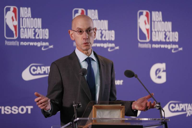 NBA commissioner Adam Silver gestures during a news conference prior to the start of an NBA basketball game between New York Knicks and Washington Wizards at the O2 Arena, in London, Thursday, Jan.17, 2019. (AP Photo/Alastair Grant)
