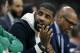 Boston Celtics' Kyrie Irving, who did not play, sits on the bench during the first half of an NBA basketball game against the Detroit Pistons in Boston, Wednesday, Feb. 13, 2019. (AP Photo/Michael Dwyer)
