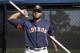 Houston Astros pitcher Josh James uses a bar to stretch during spring training baseball practice Friday, Feb. 15, 2019, in West Palm Beach, Fla. (AP Photo/Jeff Roberson)