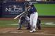 Milwaukee Brewers' Lorenzo Cain (6) hits a double during the fifth inning of Game 2 of the National League Championship Series baseball game against the Los Angeles Dodgers Saturday, Oct. 13, 2018, in Milwaukee. (AP Photo/Charlie Riedel)