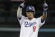 Los Angeles Dodgers' Manny Machado reacts after hitting a double during the first inning of Game 3 of the National League Championship Series baseball game Monday, Oct. 15, 2018, in Los Angeles. (AP Photo/Jae Hong)