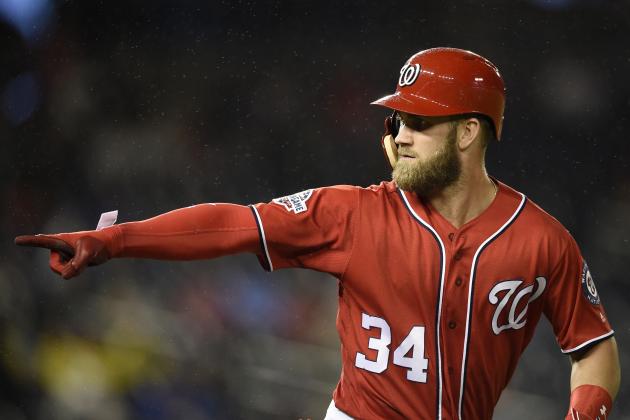 FILE - In this Sept. 8, 2018, file photo, Washington Nationals' Bryce Harper pointing to the dugout after he hit a two-run home run during the seventh inning of the second baseball game of a doubleheader against the Chicago Cubs, in Washington. As the start of spring training approaches, the Washington Nationals are waiting right along with the rest of the world to find out where Harper will be playing next season. (AP Photo/Nick Wass, File)