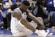 Duke's Zion Williamson sits on the floor following a injury during the first half of an NCAA college basketball game against North Carolina in Durham, N.C., Wednesday, Feb. 20, 2019. (AP Photo/Gerry Broome)