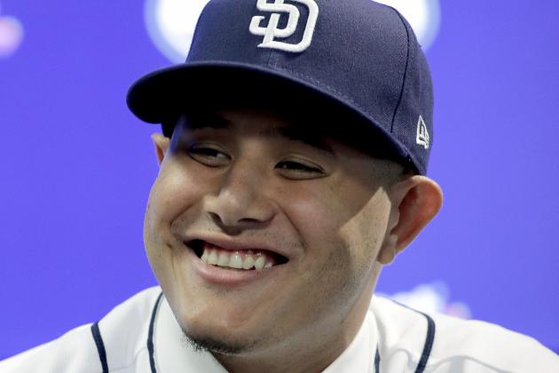 Manny Machado talks to the media during a news conference at San Diego Padres spring training baseball camp Friday, Feb. 22, 2019, in Peoria, Ariz. Machado signed a 10-year, $300 million deal to join the Padres. (AP Photo/Charlie Riedel)