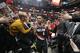 Fans reach for Portland Trail Blazers guard Damian Lillard (0) following the Blazers' 109-104 victory against the Utah Jazz in an NBA basketball game, Monday, Jan. 21, 2019, in Salt Lake City. (AP Photo/Rick Bowmer)