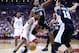 TORONTO, ON - FEBRUARY 22: Kawhi Leonard #2 of the Toronto Raptors dribbles the ball as Rudy Gay #22 of the San Antonio Spurs defends during the first half of an NBA game at Scotiabank Arena on February 22, 2019 in Toronto, Canada. NOTE TO USER: User expressly acknowledges and agrees that, by downloading and or using this photograph, User is consenting to the terms and conditions of the Getty Images License Agreement. (Photo by Vaughn Ridley/Getty Images)