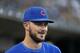 Chicago Cubs' Kris Bryant smiles in the dugout in the third inning of a baseball game against the Detroit Tigers in Detroit, Tuesday, Aug. 21, 2018. (AP Photo/Paul Sancya)