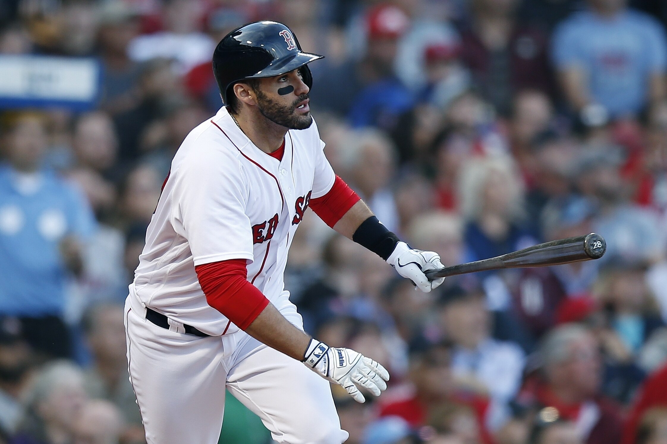 Boston Red Sox's J.D. Martinez watches his three-run home run during the fourth inning of a baseball game against the New York Yankees in Boston, Sunday, Sept. 30, 2018. (AP Photo/Michael Dwyer)