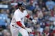 Boston Red Sox's J.D. Martinez watches his three-run home run during the fourth inning of a baseball game against the New York Yankees in Boston, Sunday, Sept. 30, 2018. (AP Photo/Michael Dwyer)