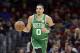 Boston Celtics' Jayson Tatum drives to the basket against the Cleveland Cavaliers in the first half of an NBA basketball game, Tuesday, Feb. 5, 2019, in Cleveland. (AP Photo/Tony Dejak)