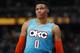 Oklahoma City Thunder guard Russell Westbrook looks at the scoreboard as time runs out in the second half of an NBA basketball game against the Denver Nuggets Tuesday, Feb. 26, 2019, in Denver. The Nuggets won 121-112. (AP Photo/David Zalubowski)
