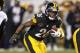 FILE - In this Sunday, Dec. 10, 2017 file photo, Pittsburgh Steelers running back Le'Veon Bell (26) plays in an NFL football game against the Baltimore Ravens in Pittsburgh. Antonio Brown, Le'Veon Bell and Ben Roethlisberger are among a Pro Bowl high of eight Pittsburgh Steelers to make the all-star game. Twenty-four of the 86 Pro Bowl selections announced Tuesday, Dec. 19, 2017 are newcomers. (AP Photo/Keith Srakocic, File)