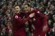 LIVERPOOL, ENGLAND - FEBRUARY 27: Virgil van Dijk of Liverpool celebrates scoring his second goal with team mate Andrew Robertson during the Premier League match between Liverpool FC and Watford FC at Anfield on February 27, 2019 in Liverpool, United Kingdom. (Photo by Visionhaus/Getty Images)