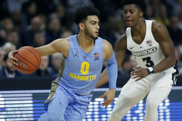 Marquette's Markus Howard (0) drives past Providence's David Duke (3) during the first half of an NCAA college basketball game in Providence, R.I., Saturday, Feb. 23, 2019. (AP Photo/Michael Dwyer)