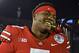 Ohio State quarterback Dwayne Haskins smiles, with a rose between his teeth, after Ohio State defeated Washington 28-23 in the Rose Bowl NCAA college football game Tuesday, Jan. 1, 2019, in Pasadena, Calif. (AP Photo/Mark J. Terrill)
