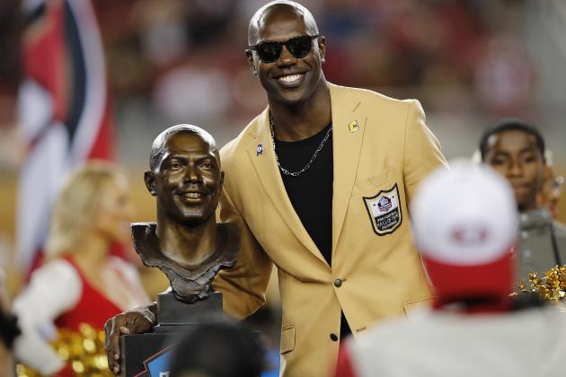 Former NFL wide receiver Terrell Owens poses next to his Pro Football Hall of Fame bust during halftime of an NFL football game between the San Francisco 49ers and the Oakland Raiders in Santa Clara, Calif., Thursday, Nov. 1, 2018. (AP Photo/John Hefti)