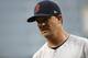Boston Red Sox starting pitcher Steven Wright walks off the field between innings of a baseball game against the Baltimore Orioles, Monday, June 11, 2018, in Baltimore. (AP Photo/Patrick Semansky)