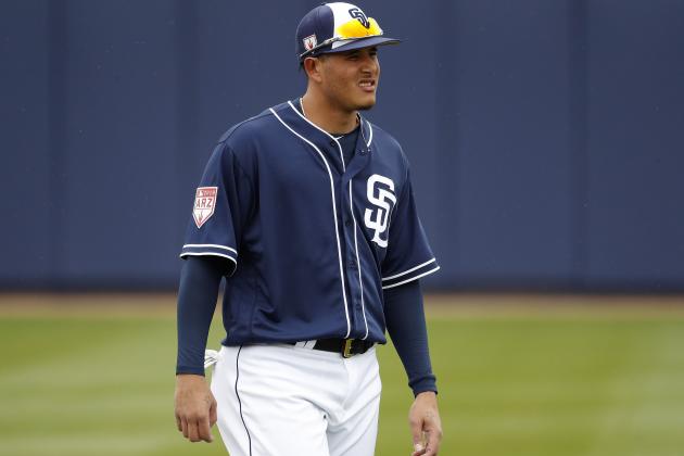 San Diego Padres' Manny Machado warms up prior to his first spring training baseball game of the season against the San Francisco Giants, Saturday, March 2, 2019, in Peoria, Ariz. (AP Photo/Matt York)