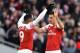 Arsenal's Swiss midfielder Granit Xhaka (R) celebrates scoring the opening goal with Arsenal's French striker Alexandre Lacazette (L) during the English Premier League football match between Arsenal and Manchester United at the Emirates Stadium in London on March 10, 2019. (Photo by Ben STANSALL / AFP) / RESTRICTED TO EDITORIAL USE. No use with unauthorized audio, video, data, fixture lists, club/league logos or 'live' services. Online in-match use limited to 120 images. An additional 40 images may be used in extra time. No video emulation. Social media in-match use limited to 120 images. An additional 40 images may be used in extra time. No use in betting publications, games or single club/league/player publications. / (Photo credit should read BEN STANSALL/AFP/Getty Images)
