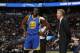 Golden State Warriors forward Draymond Green (23) and Golden State Warriors head coach Steve Kerr in the first half of an NBA basketball game Monday, Feb. 13, 201, in Denver. (AP Photo/David Zalubowski)