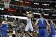 San Antonio Spurs center LaMarcus Aldridge (12) goes up for a shot in between Dallas Mavericks' Dirk Nowitzki (41), Dwight Powell (7) and Luka Doncic (77) in the first half of an NBA basketball game in Dallas, Tuesday, March 12, 2019. (AP Photo/Tony Gutierrez)