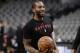 Toronto Raptors forward Kawhi Leonard, playing in his first game against the San Antonio Spurs since he was traded, warms up before an NBA basketball game, Thursday, Jan. 3, 2019, in San Antonio. (AP Photo/Eric Gay)