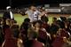 Head Coach Willis May speaks with members of the Marjory Stoneman Douglas High School football team as they started their first practice for a new season just after midnight on Monday, July 30, 2018, in Parkland, Fla. The players, their school, and community still grieves for the 17 lives lost at the school on Feb. 14. (AP Photo/Joe Skipper)
