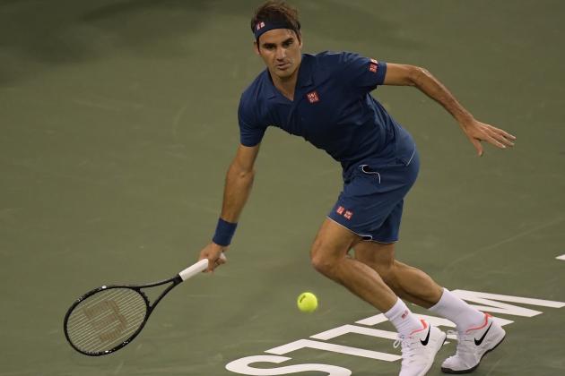 Roger Federer, of Switzerland, returns a shot to Stan Wawrinka at the BNP Paribas Open tennis tournament Tuesday, March 12, 2019 in Indian Wells, Calif. (AP Photo/Mark J. Terrill)