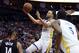 Golden State Warriors' Stephen Curry, center, shoots as Houston Rockets' Gerald Green (14) defends during the first half of an NBA basketball game, Wednesday, March 13, 2019, in Houston. (AP Photo/David J. Phillip)