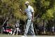 Tiger Woods holds up his golf ball after putting out on the third hole during the first round of The Players Championship golf tournament Thursday, March 14, 2019, in Ponte Vedra Beach, Fla. (AP Photo/Gerald Herbert)