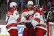 From left, Carolina Hurricanes defensemen Trevor van Riemsdyk, Dougie Hamilton and goaltender Petr Mrazek celebrate as time runs out in the third period of an NHL hockey game against the Colorado Avalanche, Monday, March 11, 2019, in Denver. Carolina won 3-0. (AP Photo/David Zalubowski)