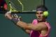 Rafael Nadal, of Spain, keeps his eyes on the ball as he hits a return to Karen Khachanov, of Russia, at the BNP Paribas Open tennis tournament Friday, March 15, 2019, in Indian Wells, Calif. (AP Photo/Mark J. Terrill)