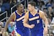 Golden State Warriors guard Klay Thompson (11) is congratulated by forward Kevin Durant, left, after making a three-point basket during the second half of an NBA basketball game against the Orlando Magic in Orlando, Fla., Sunday, Jan. 22, 2017. (AP Photo/Phelan M. Ebenhack)