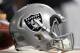 OAKLAND, CA - AUGUST 19: A detailed view of a helmet belonging to and Oakland Raiders player sitting on top of a Gatorade cooler against the Los Angeles Rams during the fourth quarter of their preseason NFL football game at Oakland-Alameda County Coliseum on August 19, 2017 in Oakland, California. The Ram won the game 24-21. (Photo by Thearon W. Henderson/Getty Images)