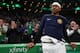 BOSTON, MASSACHUSETTS - MARCH 18: Isaiah Thomas #0 of the Denver Nuggets watches a tribute video played in his honor during the first quarter of the game against the Boston Celtics at TD Garden on March 18, 2019 in Boston, Massachusetts. NOTE TO USER: User expressly acknowledges and agrees that, by downloading and or using this photograph, User is consenting to the terms and conditions of the Getty Images License Agreement. (Photo by Maddie Meyer/Getty Images)