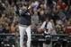 New York Yankees manager Aaron Boone calls for a new pitcher during the third inning of Game 1 of a baseball American League Division Series against the Boston Red Sox on Friday, Oct. 5, 2018, in Boston. (AP Photo/Charles Krupa)
