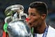 PARIS, FRANCE - JULY 10: Cristiano Ronaldo of Portugal kisses the trophy following the UEFA Euro 2016 Final match between Portugal and France at Stade de France on July 10, 2016 in Paris, France. (Photo by Chris Brunskill Ltd/Getty Images)