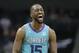 Charlotte Hornets guard Kemba Walker (15) reacts after making a basket against the Washington Wizards during the second half of an NBA basketball game in Charlotte, N.C., Friday, Feb. 22, 2019. (AP Photo/Chuck Burton)