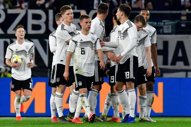 Germany's midfielder Leon Goretzka (3rd R) celebrates scoring the 1-1 equaliser with his team-mates during the friendly football match Germany v Serbia in Wolfsburg, western Germany on March 20, 2019. (Photo by Tobias SCHWARZ / AFP) / RESTRICTIONS: ACCORDING TO DFB RULES IMAGE SEQUENCES TO SIMULATE VIDEO IS NOT ALLOWED DURING MATCH TIME. MOBILE (MMS) USE IS NOT ALLOWED DURING AND FOR FURTHER TWO HOURS AFTER THE MATCH. == RESTRICTED TO EDITORIAL USE == FOR MORE INFORMATION CONTACT DFB DIRECTLY AT +49 69 67880 / (Photo credit should read TOBIAS SCHWARZ/AFP/Getty Images)