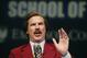 Actor and comedian Will Ferrell, who plays TV anchorman Ron Burgundy, stays in character and speaks during a news conference at Emerson College in Boston, Wednesday, Dec. 4, 2013. The school has changed the name of its School of Communication for one day to honor the fictitious television anchorman. (AP Photo/Elise Amendola)