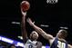 Xavier forward Tyrique Jones (0) shoots over Toledo center Luke Knapke (30) during the first half of a first round basketball game in the National Invitation Tournament, Wednesday, March 20, 2019, in Cincinnati. (AP Photo/Gary Landers)