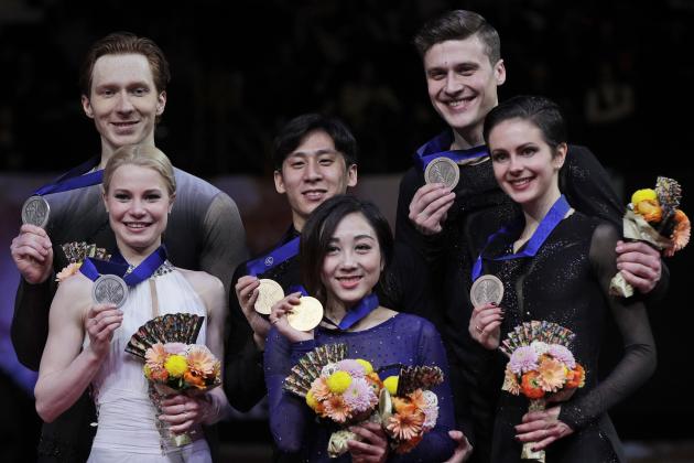 Russia's Natalia Zabiiko and Alexander Enbert, right, compatriots Russia's Evgenia Tarasova and Vladimir Morozov, left, and China's Sui Wending and Han Cong, display their bronze, silver and gold medals respectively for the pairs free skate during the ISU World Figure Skating Championships at Saitama Super Arena in Saitama, north of Tokyo, Thursday, March 21, 2019. (AP Photo/Andy Wong)