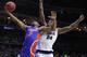 Florida guard Jalen Hudson (3) drives to the basket past Nevada forward Jordan Caroline during a first round men's college basketball game in the NCAA Tournament, Thursday, March 21, 2019, in Des Moines, Iowa. (AP Photo/Charlie Neibergall)